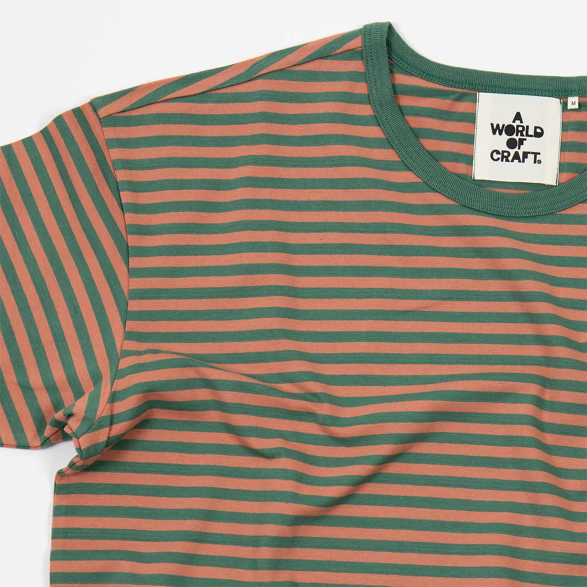 Randig kortärmad T-shirt i ekologisk bomull - Dam i färgen grön och aprikos