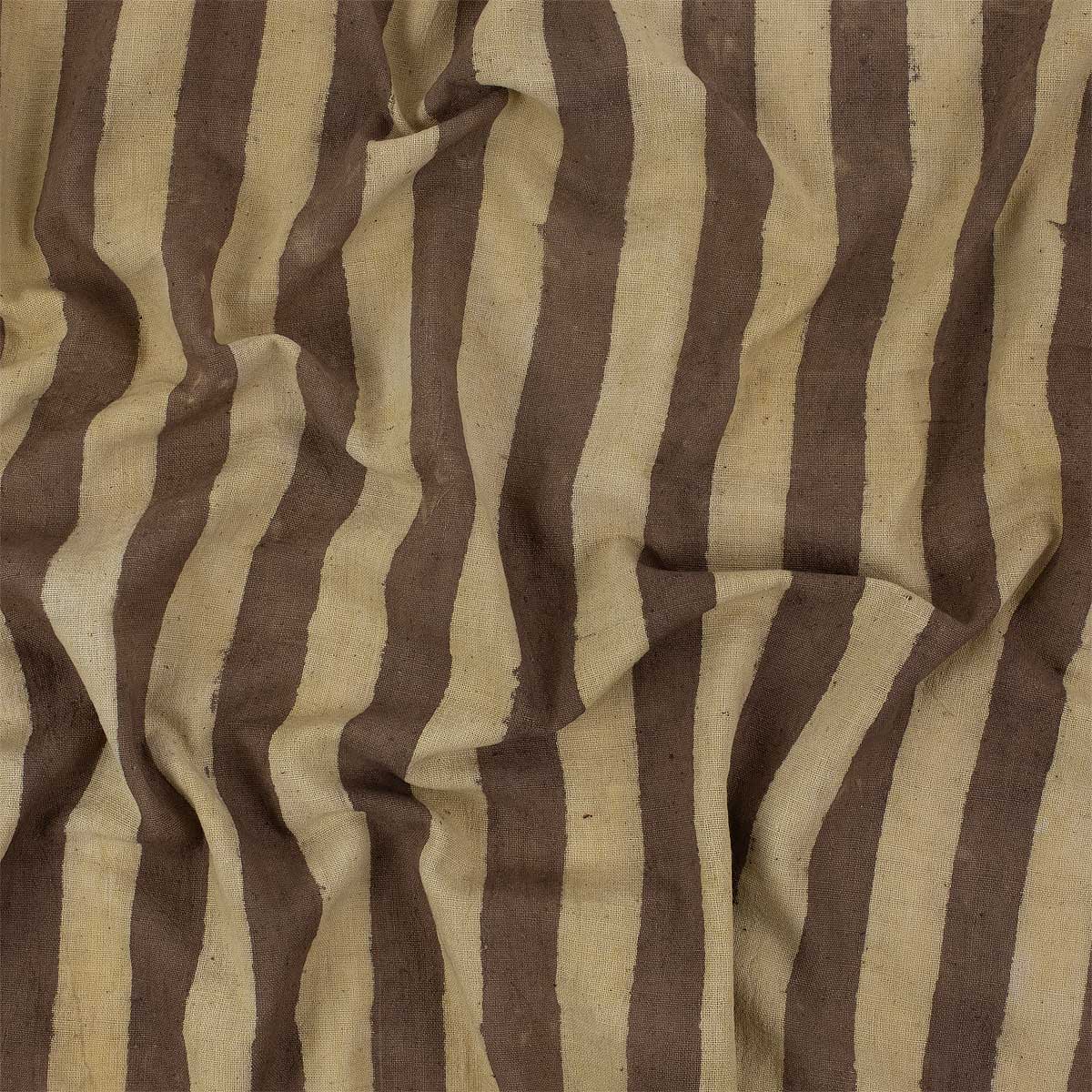 Bomullstyg på metervara i beige och brunt