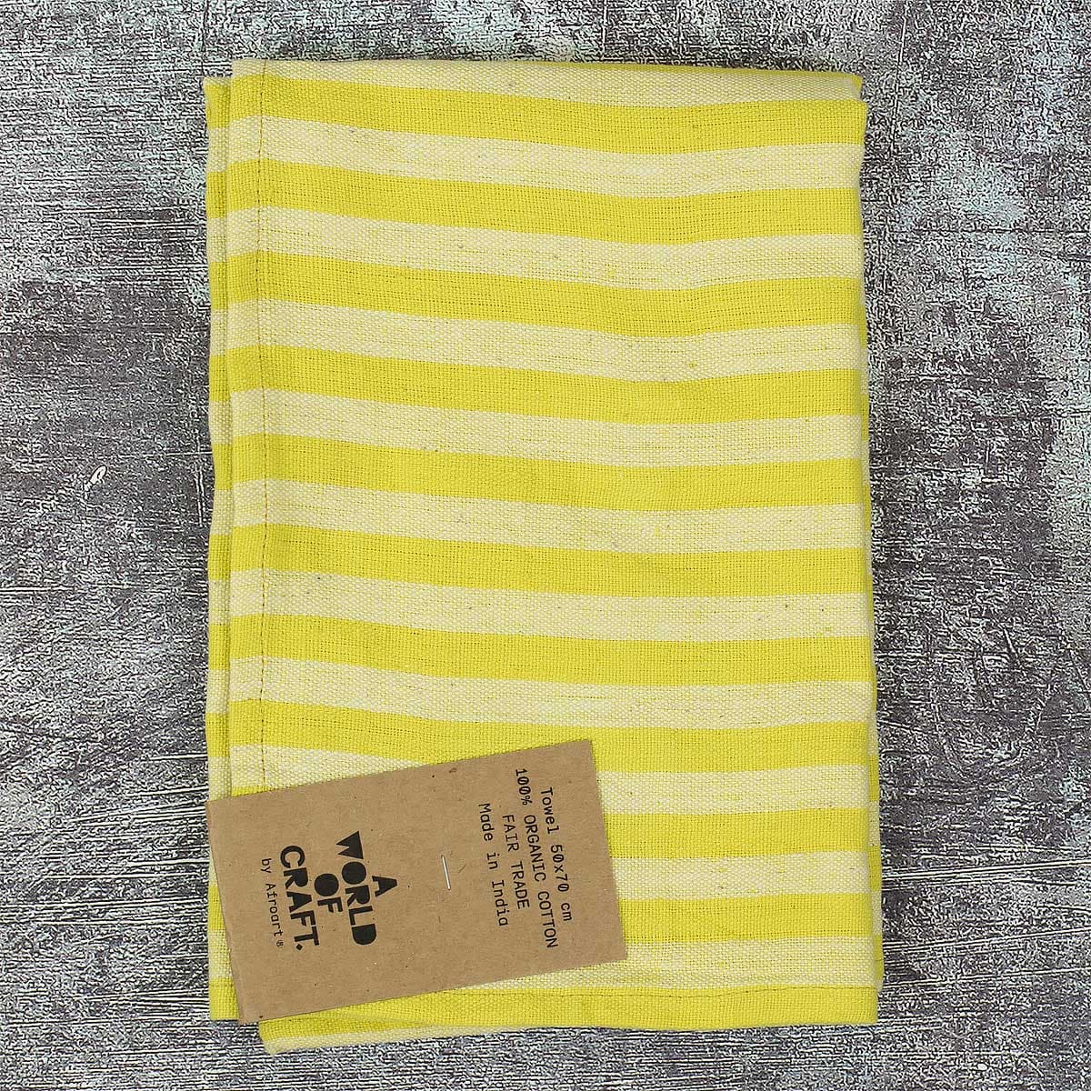 En gulrandig kökshandduk i ekologisk bomull